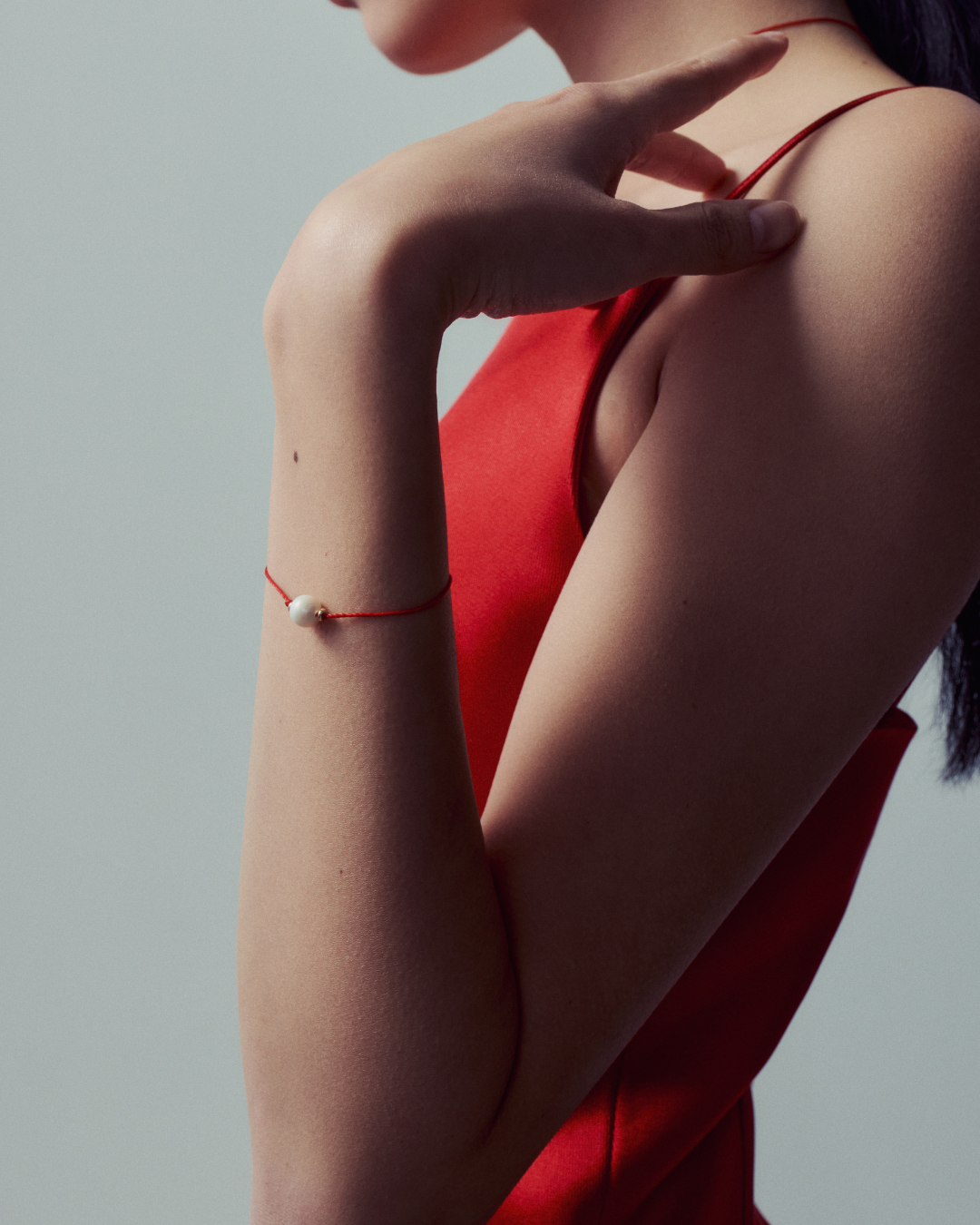 Bracelet porte-bonheur en fil rouge