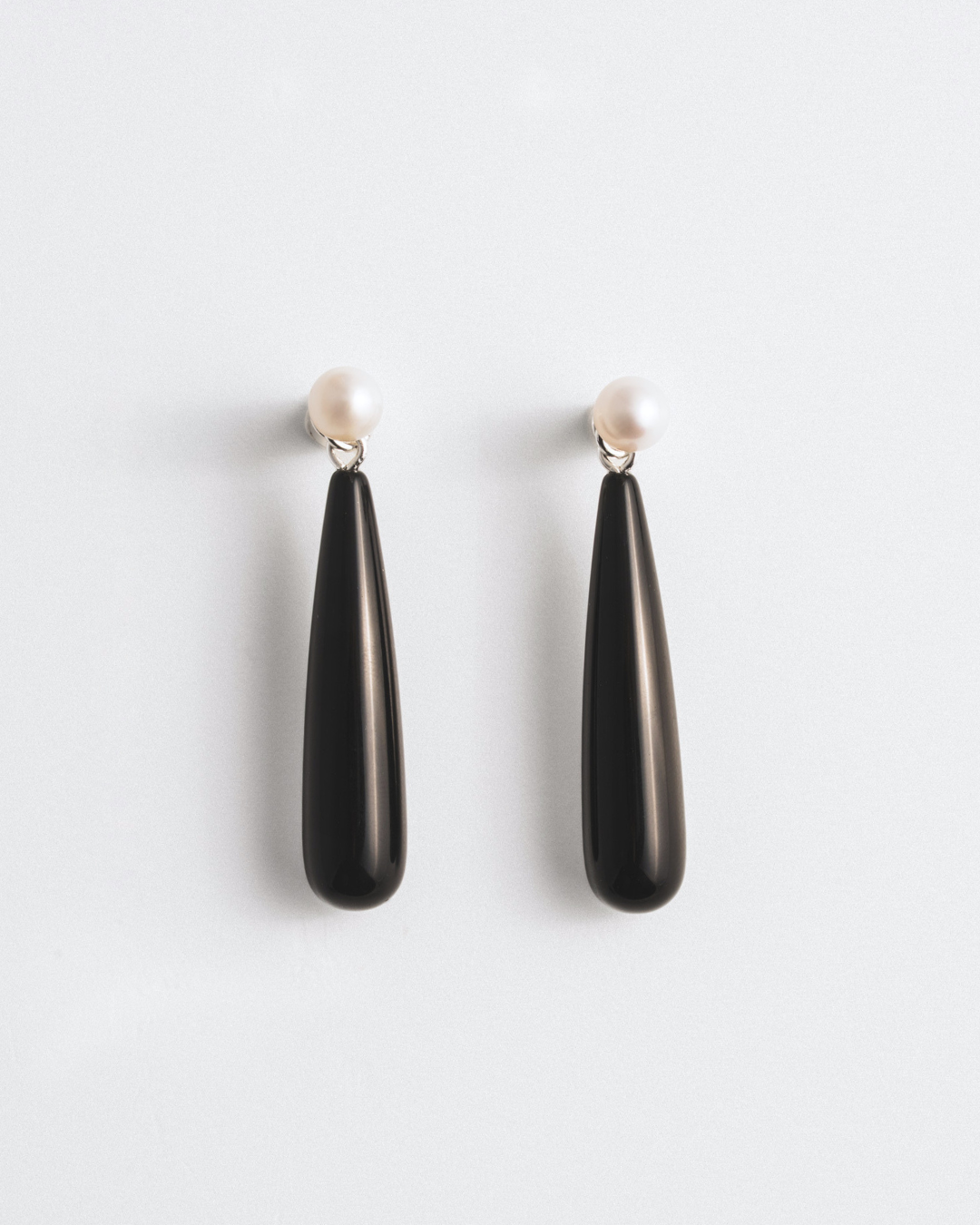 Puces d'oreilles perle et veste d'oreille onyx