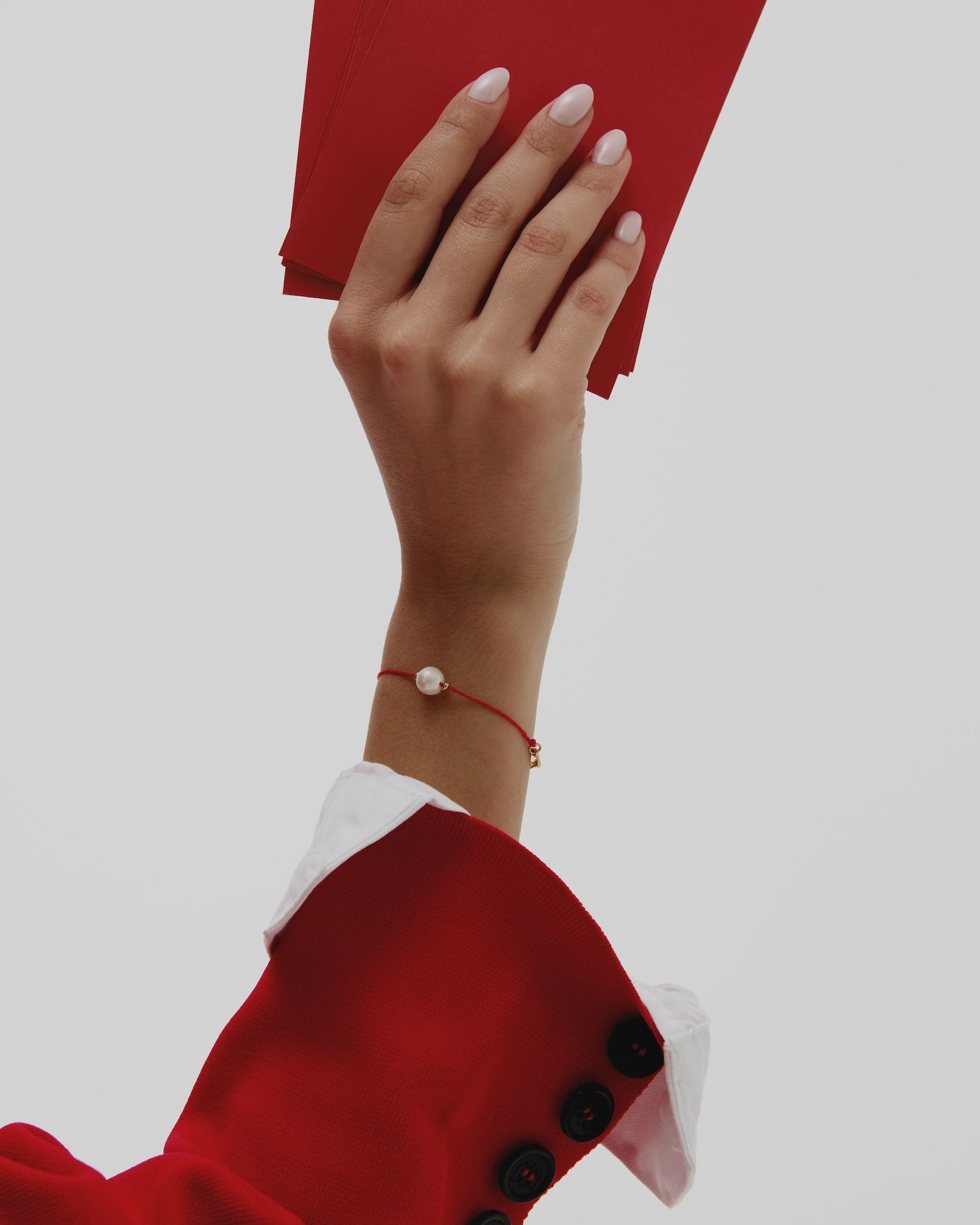 Bracelet porte-bonheur en fil rouge